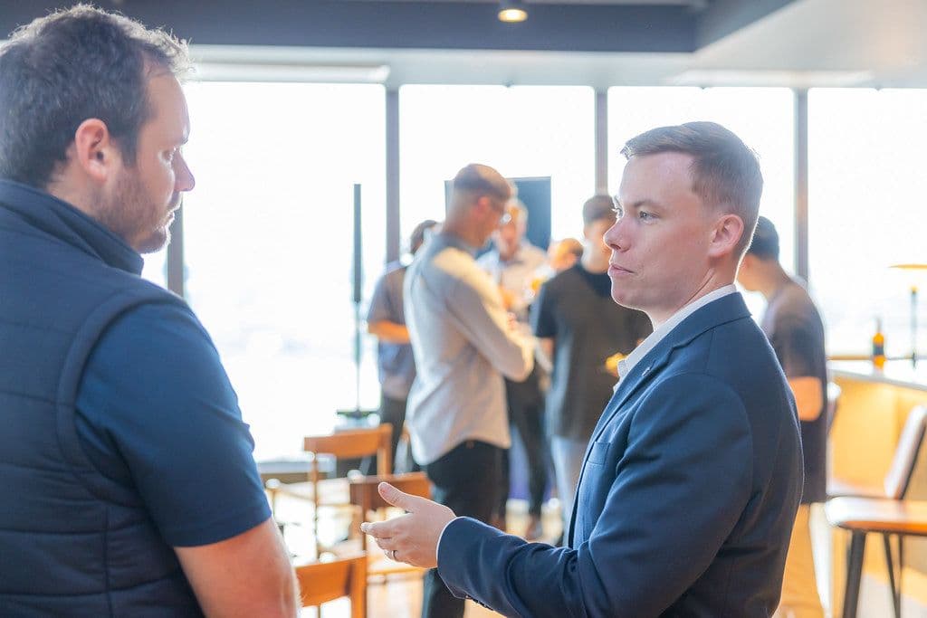 Nicholas Clunes in conversation at an industry event